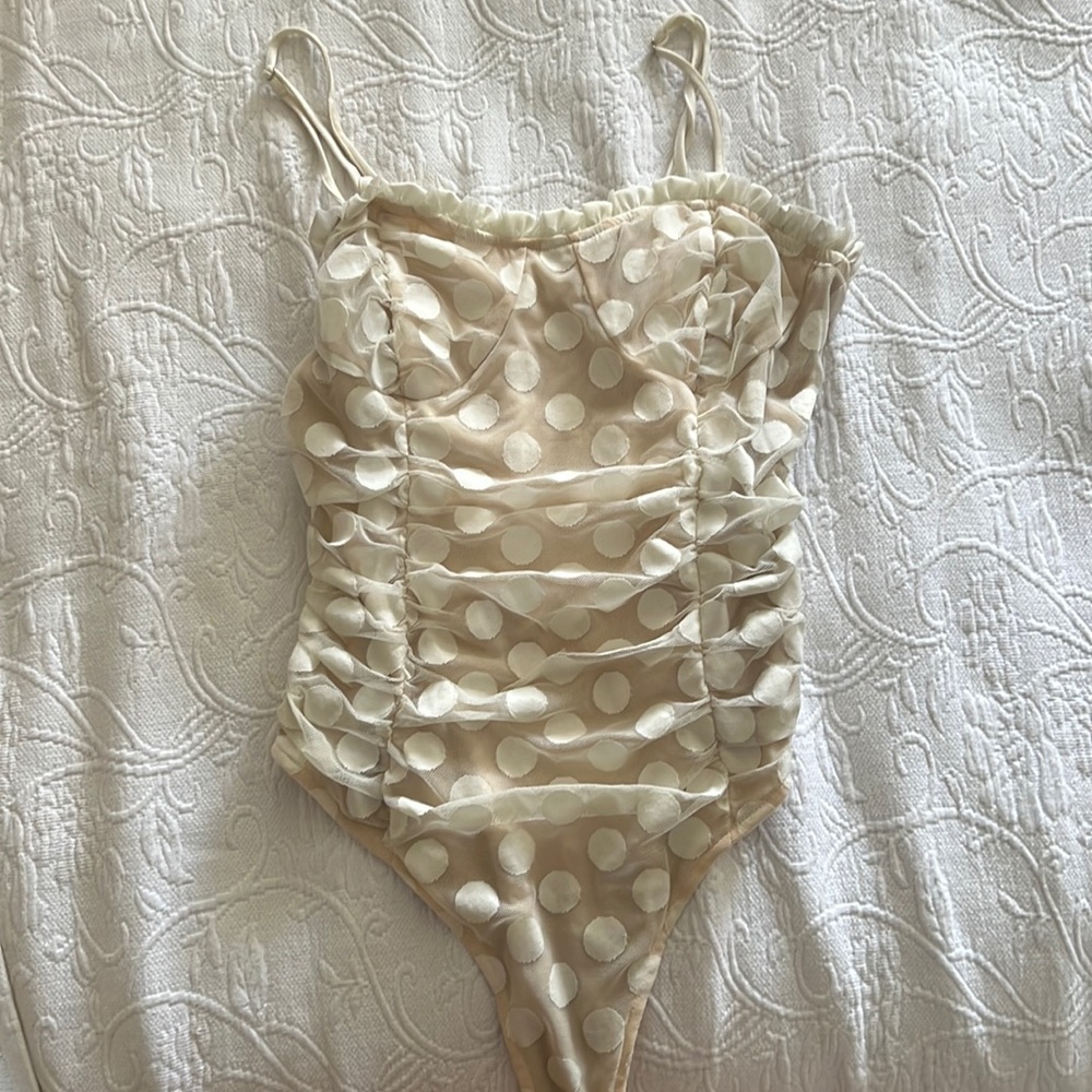 Leche bodysuit size Small